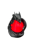 Black dragon wrapped around a glowing red orb lamp